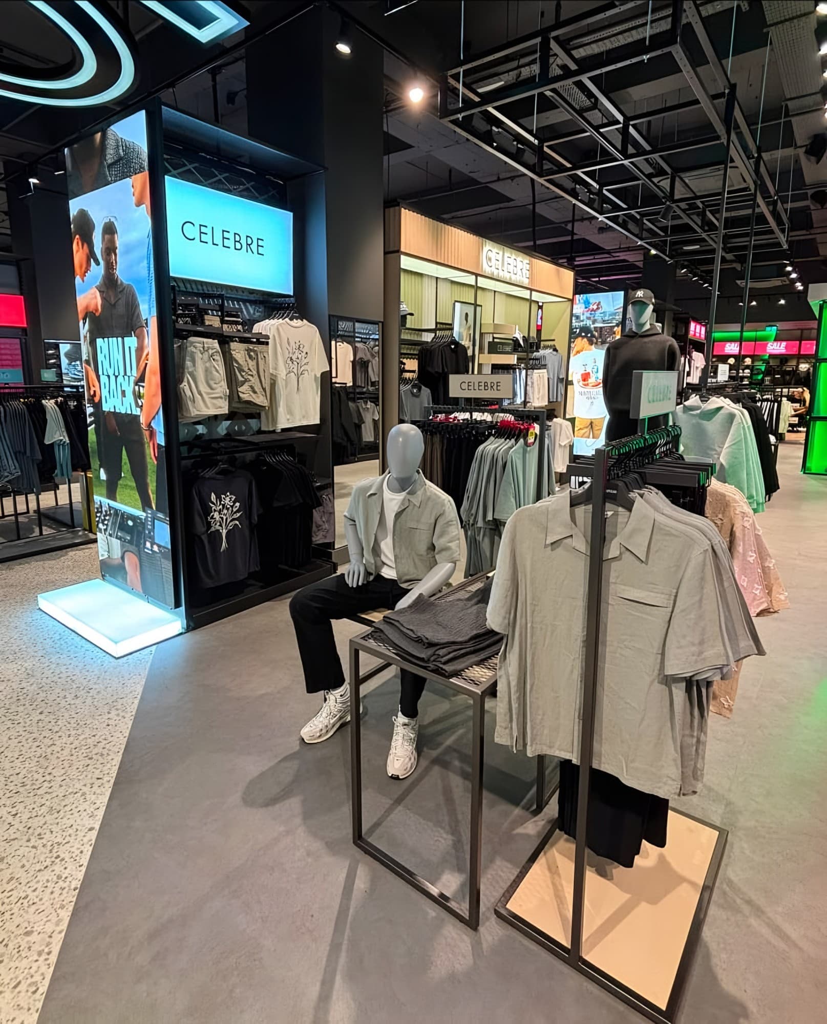 Fashion concession with a flexible-stone fascia and a terrazzo-look floor