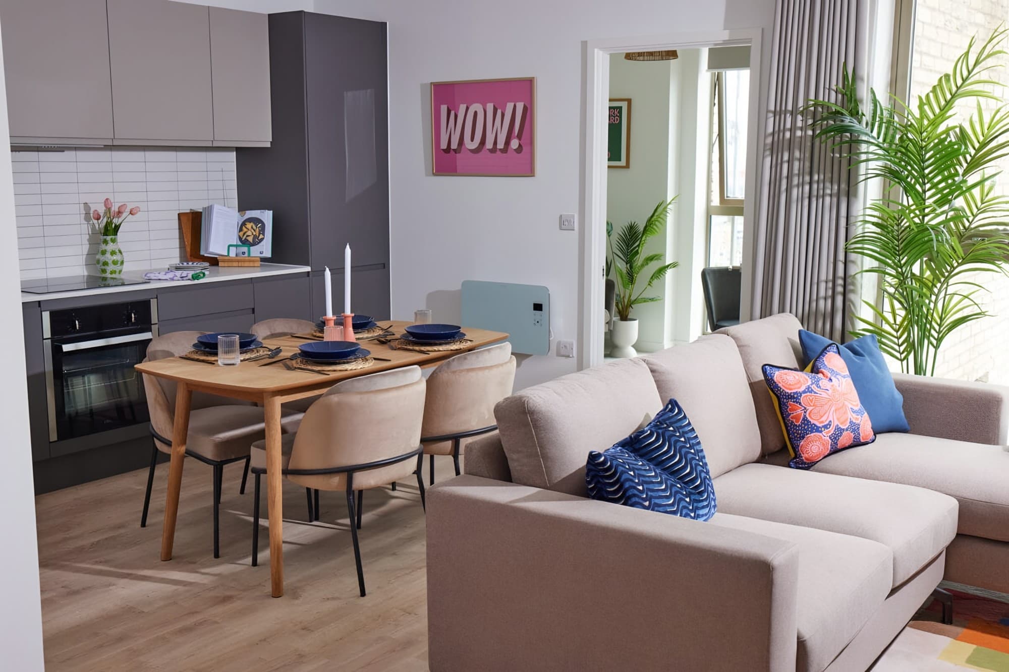 Apartment living room with curtains across a corner window